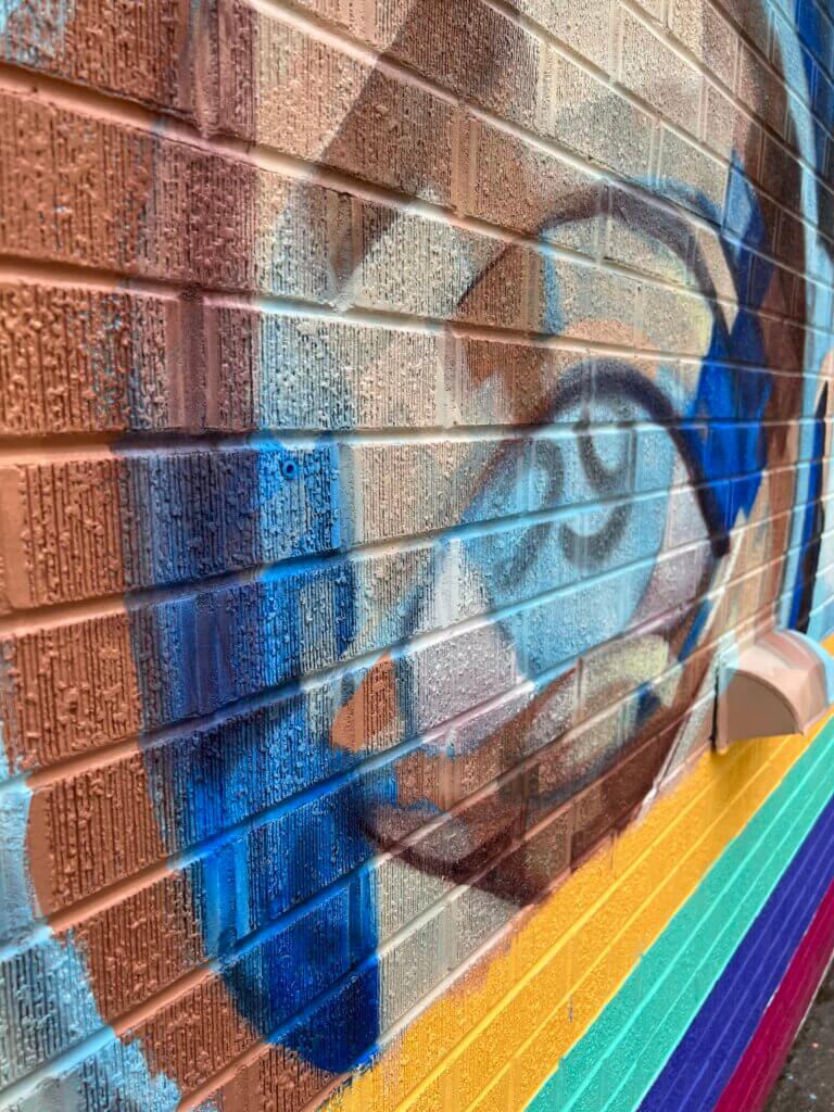 layers of transparent flesh tones creating a mosaic appearing face